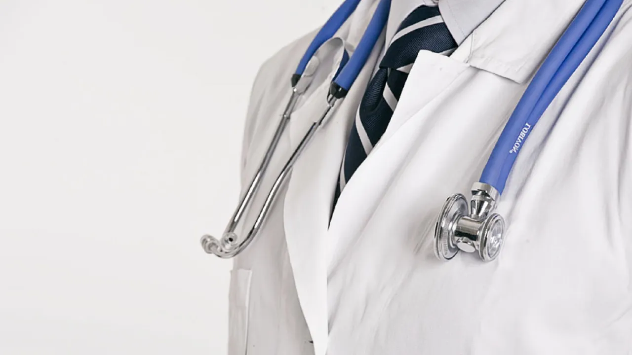 Private doctor performing a home visit in London